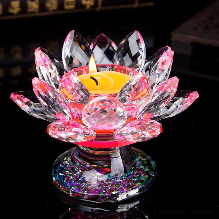 Pink-tinted crystal lotus candleholder with central crystal decoration and iridescent base - front three-quarter angle