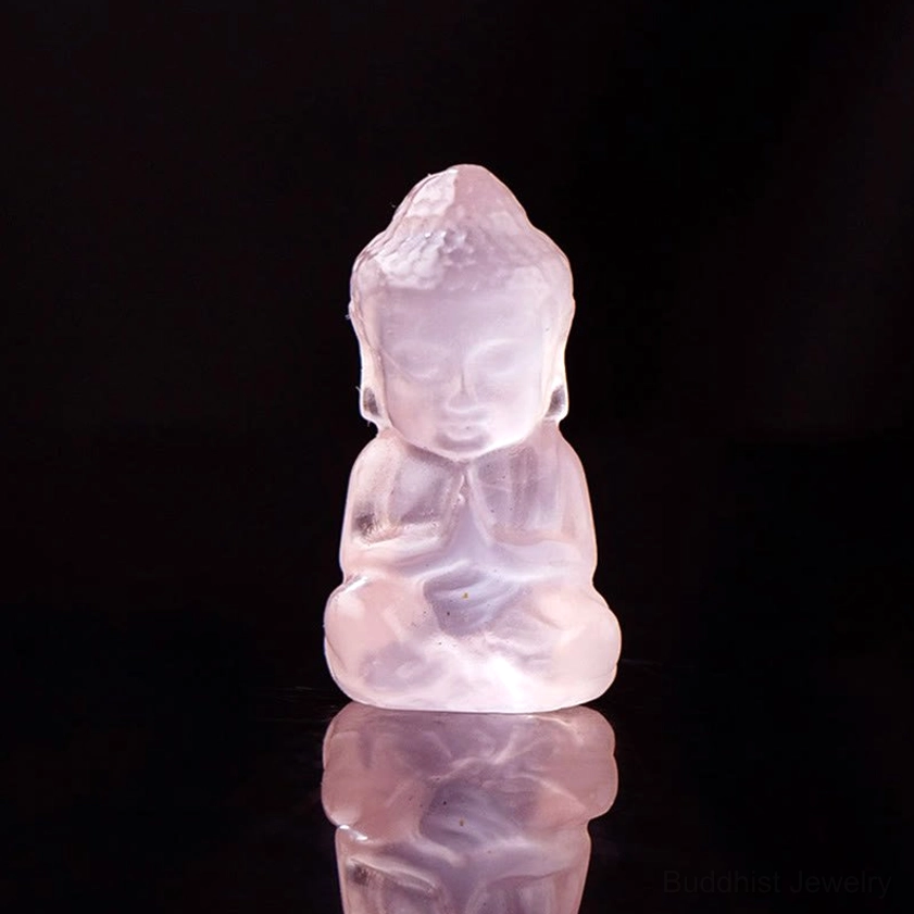 Pink crystal carved baby Buddha figurine - pale rose quartz Buddha in meditation pose with reflection