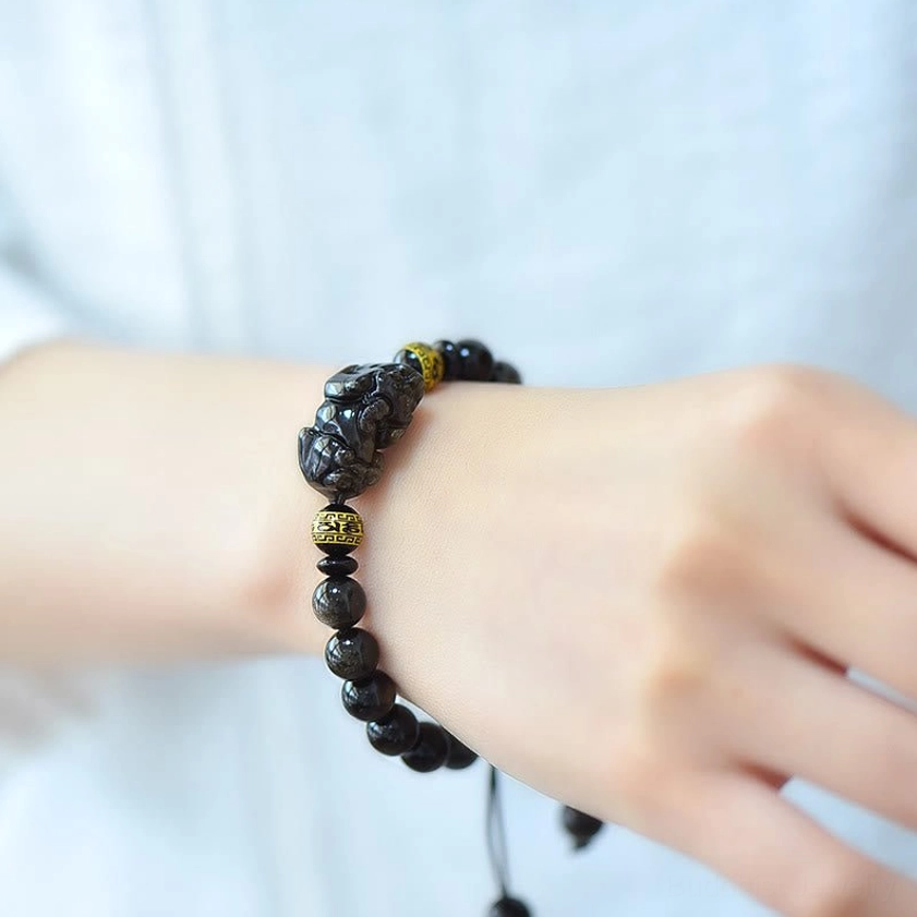 Wrist wearing demonstration of adjustable gold sheen obsidian Pixiu Buddhist bracelet in daily wear