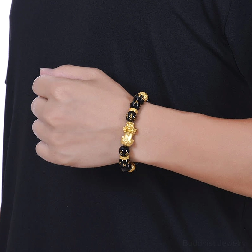 Black onyx and obsidian Pi Xiu bracelet worn on wrist showing natural fit and real-wear appearance