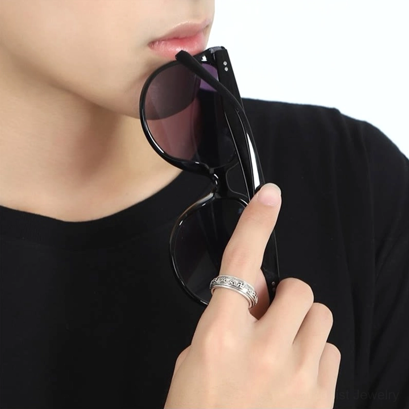 PiXiu wealth guardian ring worn on index finger with sunglasses showing delicate engraving details and antique silver finish