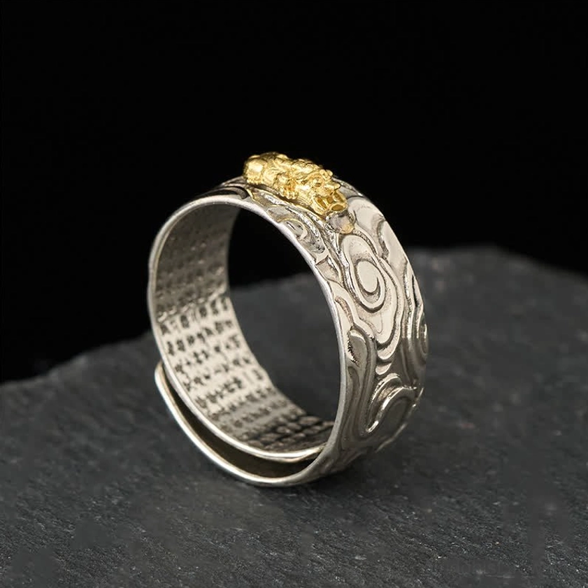 Adjustable Pixiu Heart Sutra ring displaying high-angle view with two-tone finish, embossed cloud patterns, and spiritual engraving details