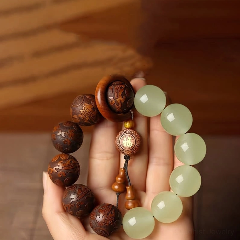 Sappan wood Pixiu Fu character Buddhist bracelet with jade beads, overhead view on wooden surface