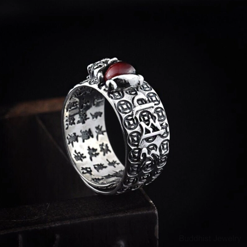 PiXiu Red Garnet Ring low angle detail - showcasing vintage silver finish, PiXiu charm with red garnet, and sacred inner inscriptions