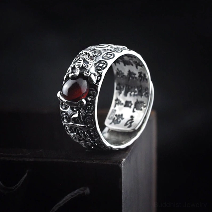 PiXiu Red Garnet Ring side profile - showing intricate silver carved details, red garnet stone, and inner Buddhist sutra engravings