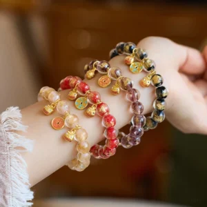 Gold Pixiu wealth fortune bracelets with liuli glass beads and copper coins - multiple color variations displayed on wrist