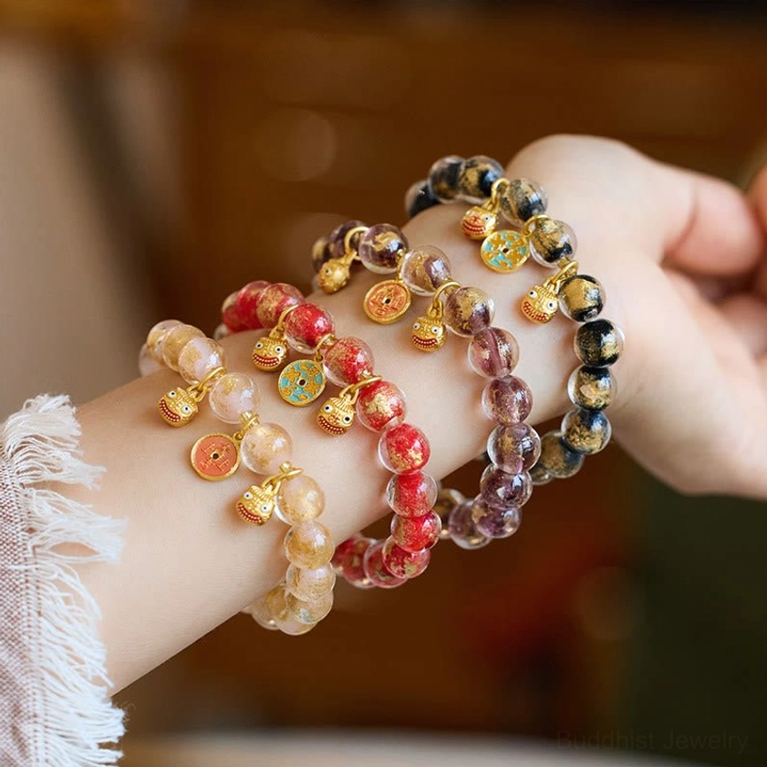 Gold Pixiu wealth fortune bracelets with liuli glass beads and copper coins - multiple color variations displayed on wrist