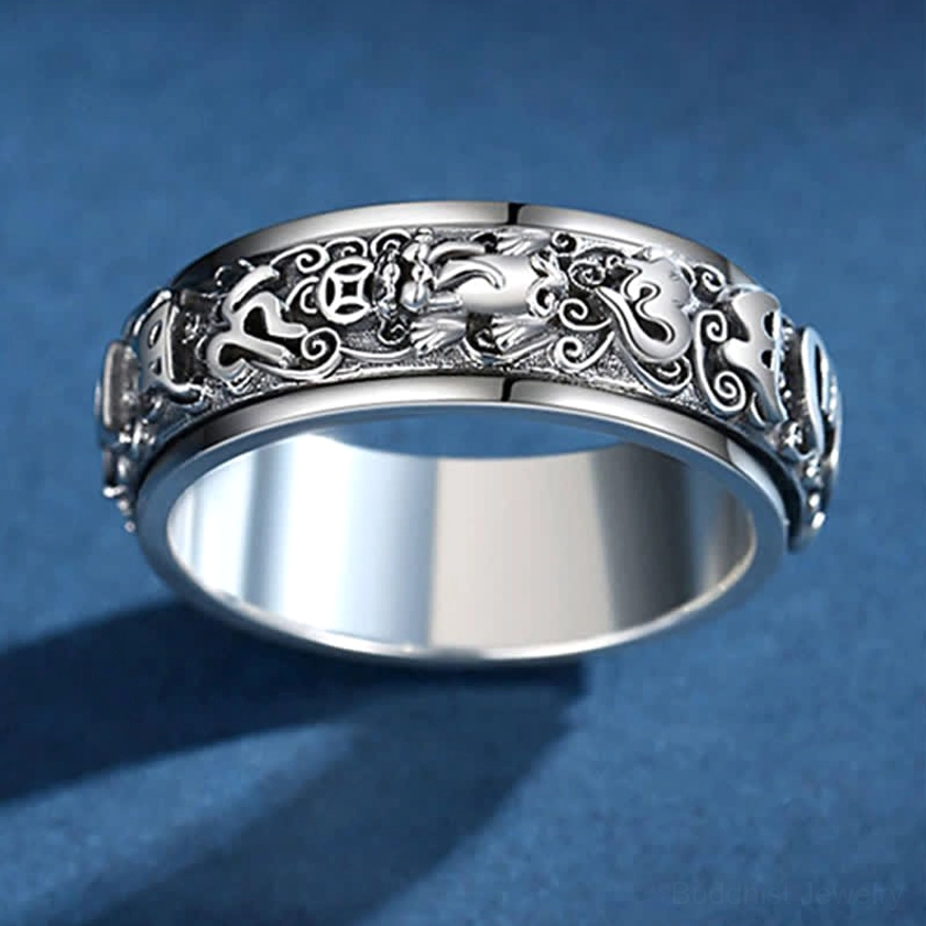 Pixiu Om Mani Padme Hum rotatable copper ring worn on hand, demonstrating comfortable fit and active meditation spinning practice