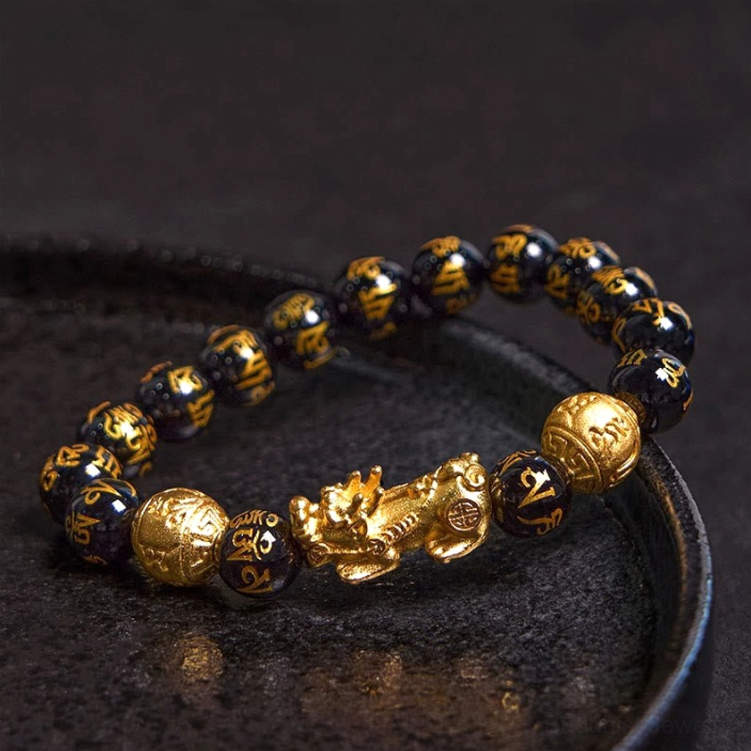 Obsidian Pixiu Beaded Bracelet close-up showing engraved Six True Words mantra on black stones