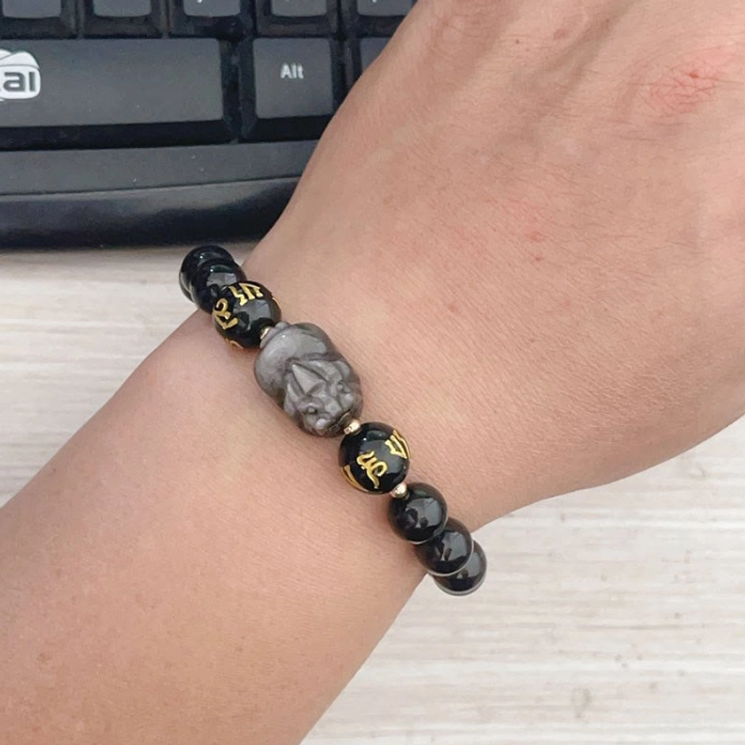 Wrist-worn Silver Sheen Obsidian Pixiu Buddhist bracelet showcasing comfortable everyday wear with mantra beads