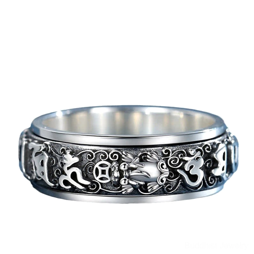 Pixiu protective guardian and Om Mani Padme Hum rotatable meditation ring, artistic flat lay view highlighting spiritual design elements