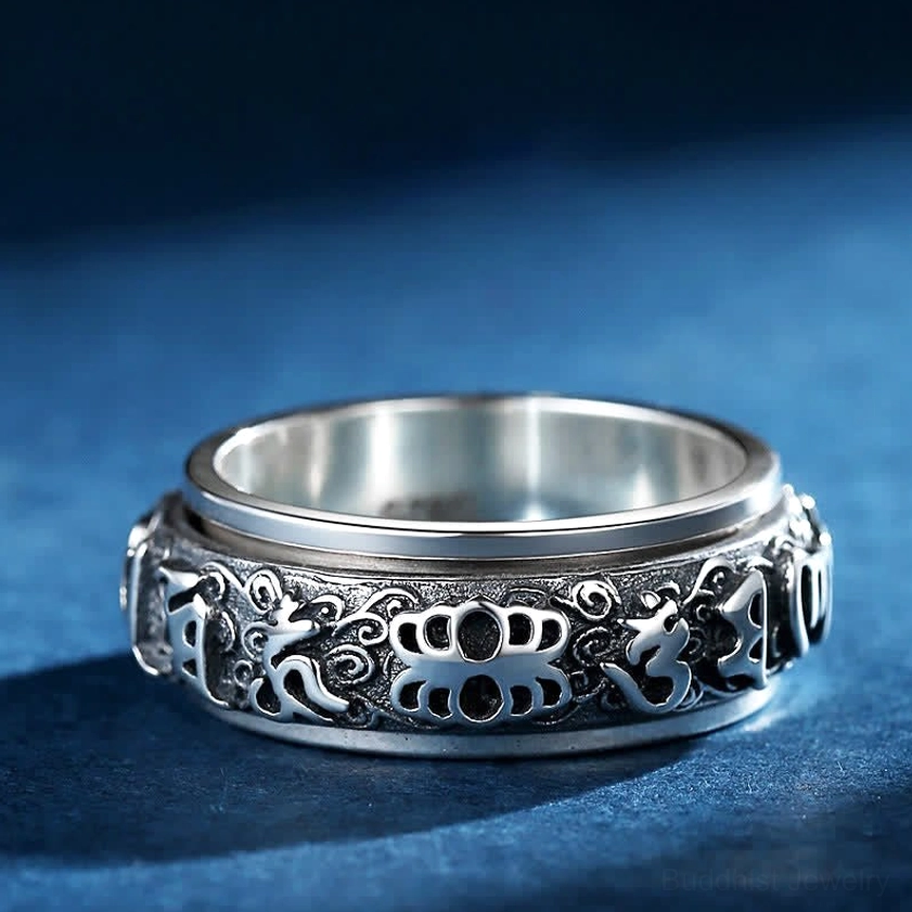 Copper Pixiu spiritual ring with two-tone silver design and full carved outer band featuring Om Mani Padme Hum and protective guardian symbols, front eye-level view