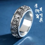 Pixiu Om Mani Padme Hum copper rotatable meditation ring with carved sacred motifs and vintage finish, side view showing intricate Pixiu and mantra engravings