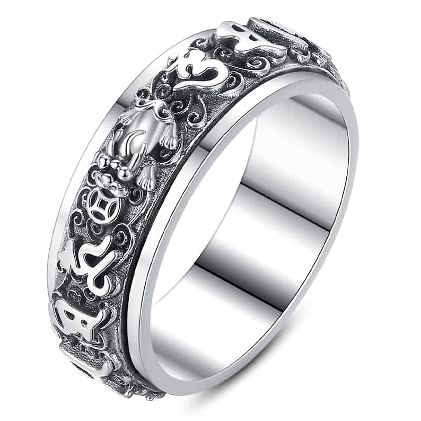 Close-up detail of Pixiu Om Mani Padme Hum rotatable ring showing intricate carved Buddhist symbols, mantra engravings, and artisan craftsmanship
