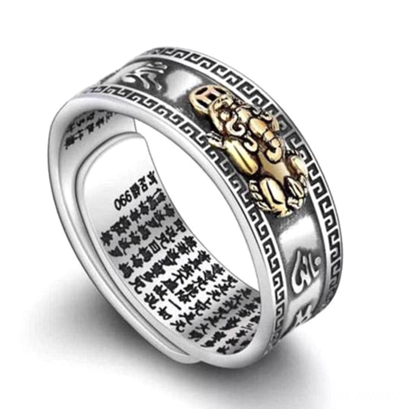 Pixiu feng shui ring detail showing traditional geometric border engraving, six-syllable mantra Om Mani Padme Hum markings, and 990 silver hallmark