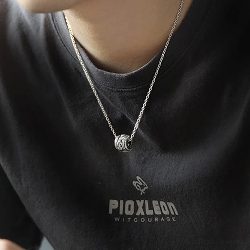 Pixiu rotating necklace pendant worn on neck showing minimalist layered styling with slim metal chain in casual daily wear