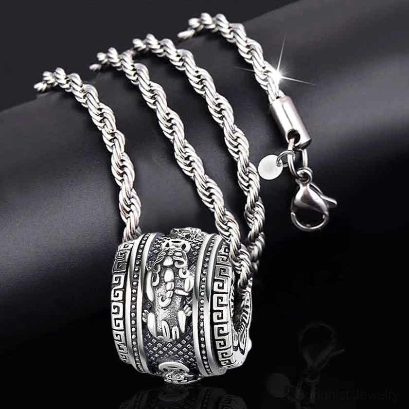 Pixiu necklace set with rotating pendant, twisted rope chain, lobster claw clasp, and detailed antique silver pendant on dark background