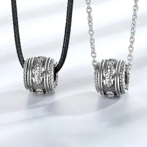 Pixiu rotating wealth necklace pendant with optional chains - flat lay studio view showing vintage silver carved details and dual chain styles