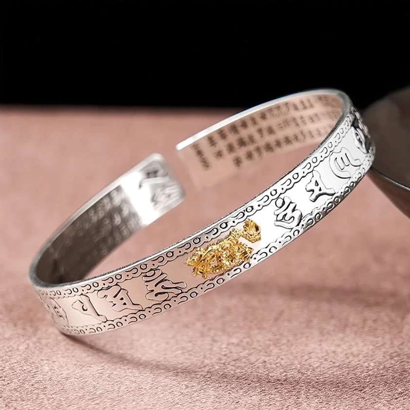 Pixiu silver bangle bracelet reverse three-quarter view showing inner mantras and gold Pixiu ornament