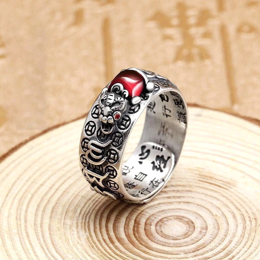 Single Pixiu wealth adjustable ring with detailed carving, red garnet inlay, Heart Sutra inner engraving on light wood