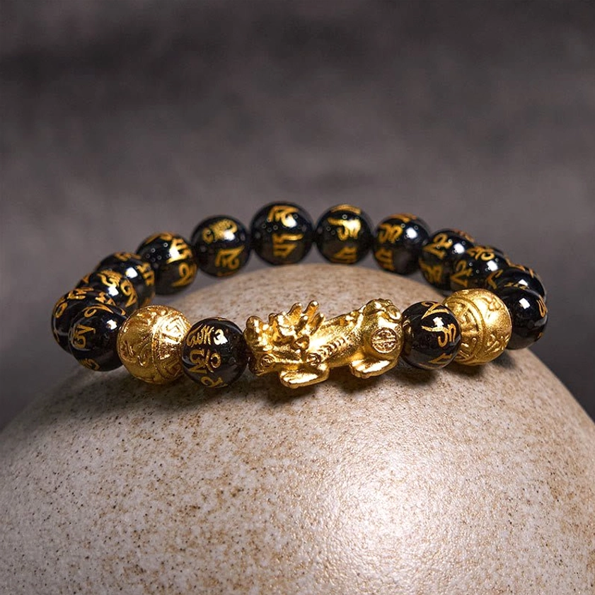 Buddhist PiXiu obsidian wealth bracelet alternative angle showing texture and craftsmanship of natural obsidian beads