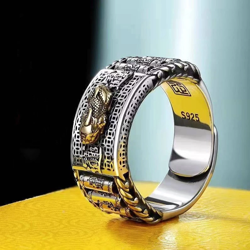 Pixiu wealth prayer wheel ring in gold finish - side overhead close-up view showcasing S925 sterling silver stamp and vintage carved Buddhist prosperity symbol design