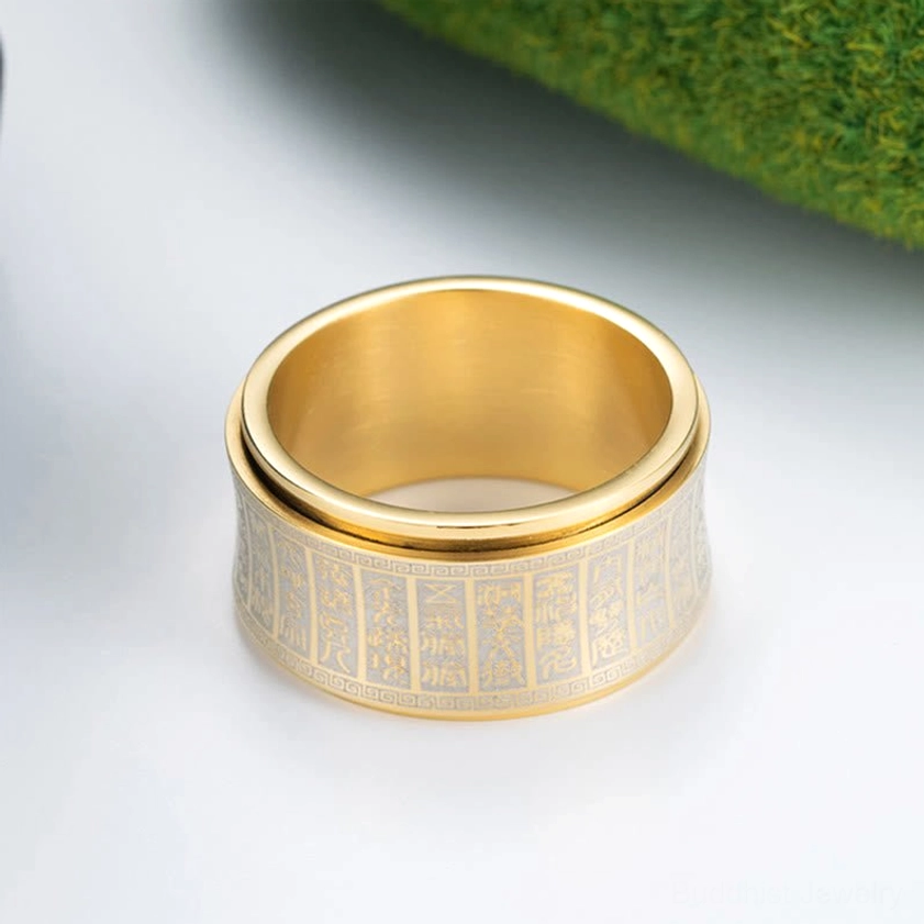 Polished gold Buddhist mantra spinner ring with wide rotating engraved band detail