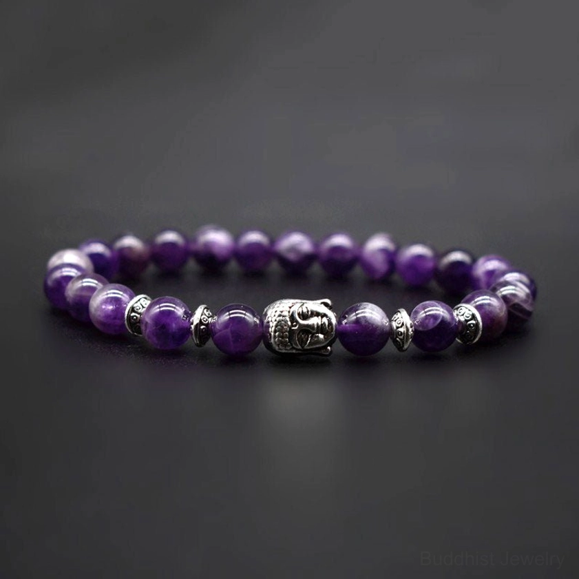 Lapis lazuli and polished stone Buddhist bracelet with matte finish beads and silver Buddha decorative elements