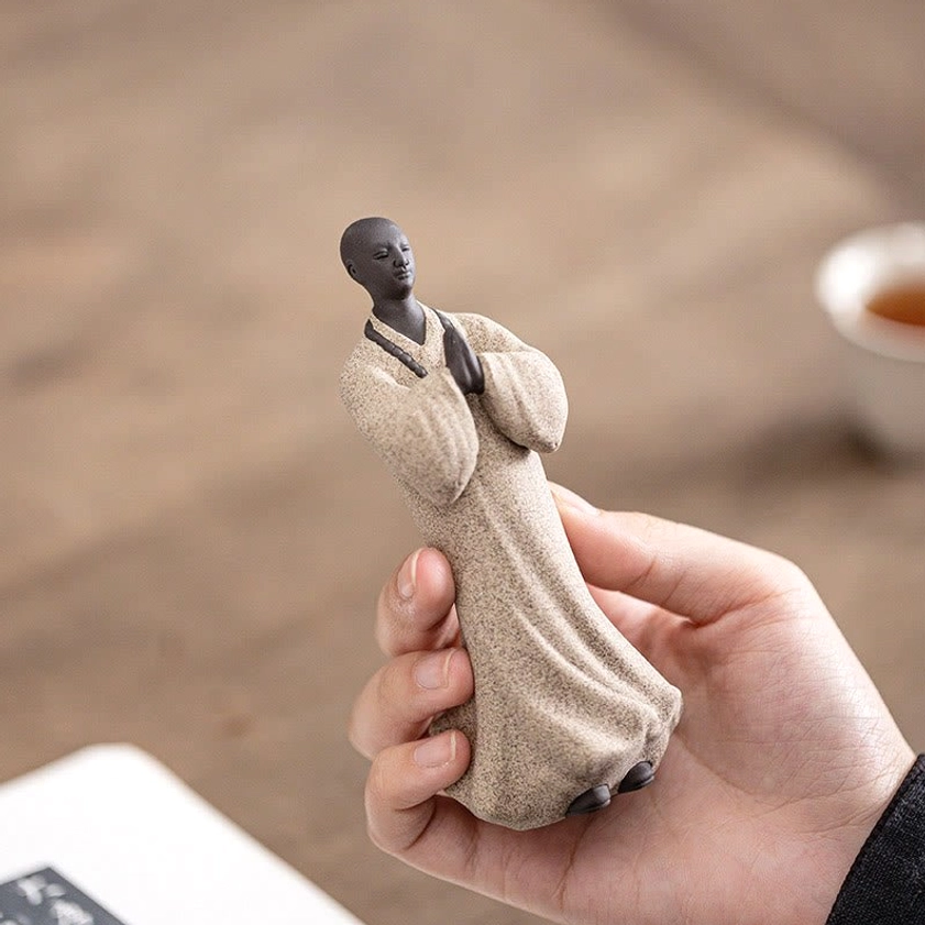 Portable ceramic meditation monk figurine ideal for personal mindfulness practice and spiritual reflection