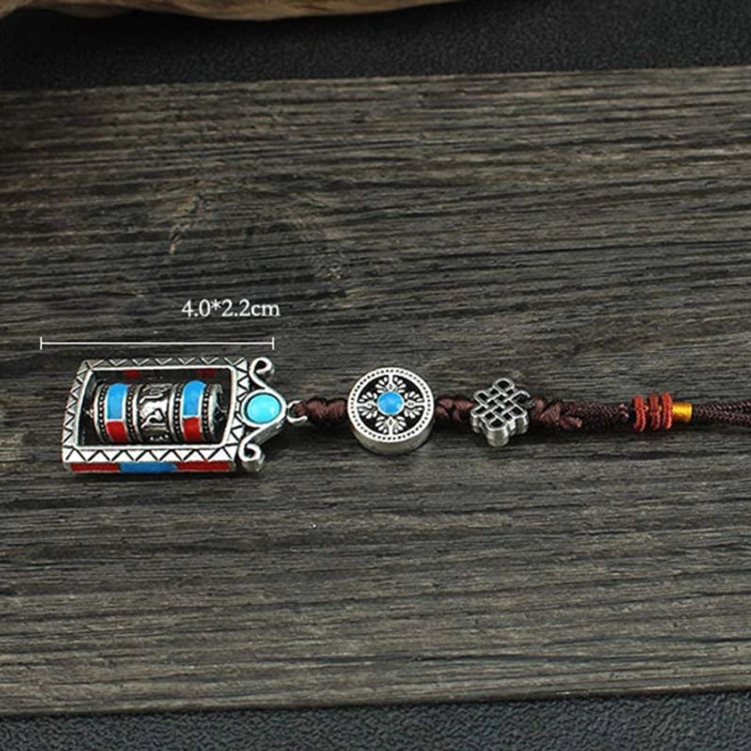 Portable prayer wheel keychain with sacred Om Mani Padme Hum inscriptions for enlightenment and compassion