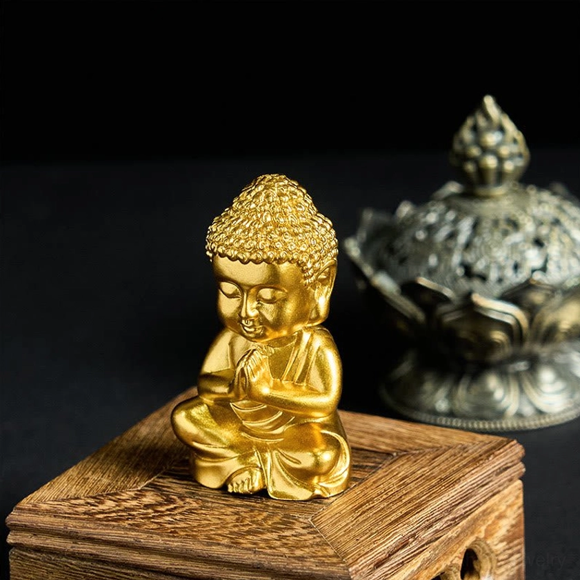 Prayer pose baby Buddha statue fridge magnet left angle on wooden display stand with incense holder