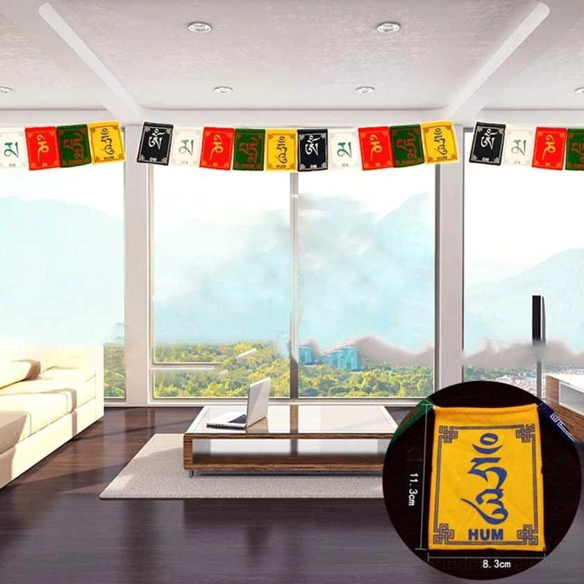 Traditional Buddhist prayer flags displaying five sacred colors displayed in modern home living room interior