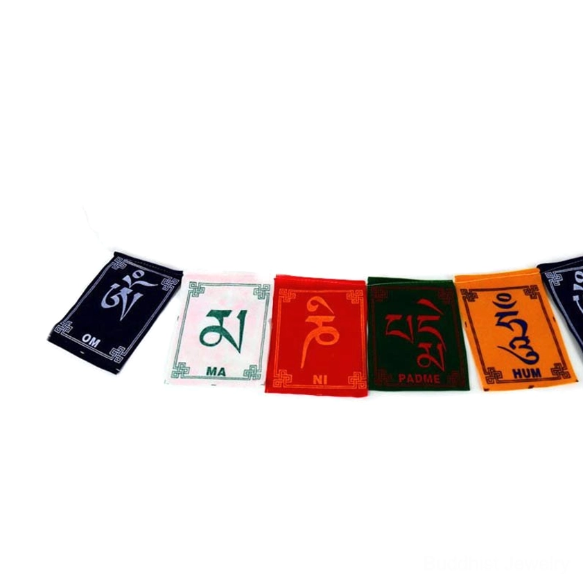 Handcrafted Buddhist prayer flags with traditional wooden block printing technique details visible