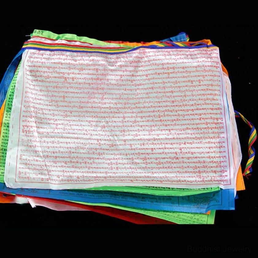 Size comparison of Buddhist prayer flags showing large 13.8 inch individual flag dimensions for maximum impact