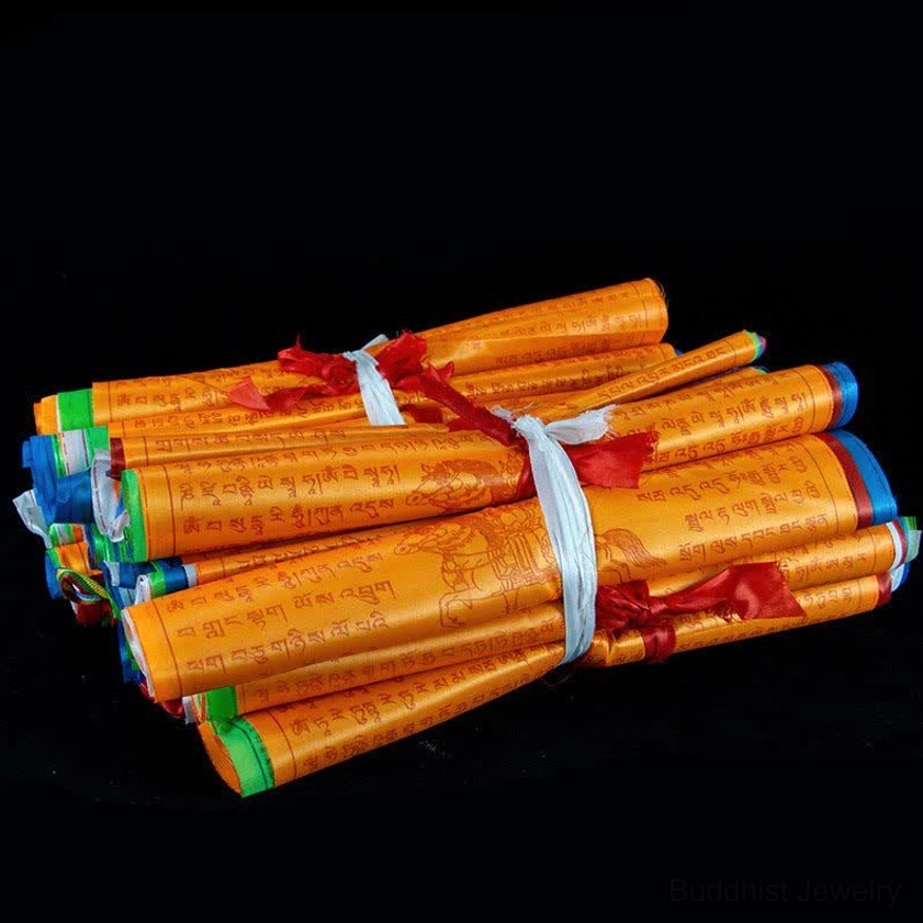 Scattered loose prayer flags in five traditional Buddhist colors tied with colorful rope for display