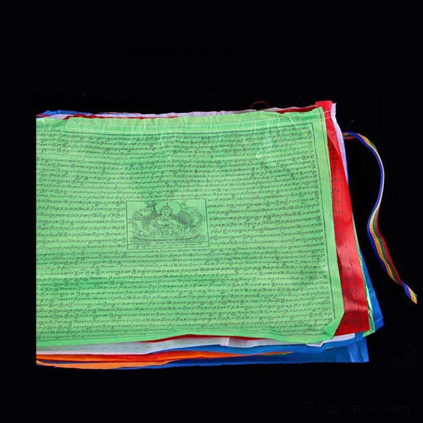 Buddhist prayer flags fluttering in outdoor breeze demonstrating wind movement and spiritual energy circulation