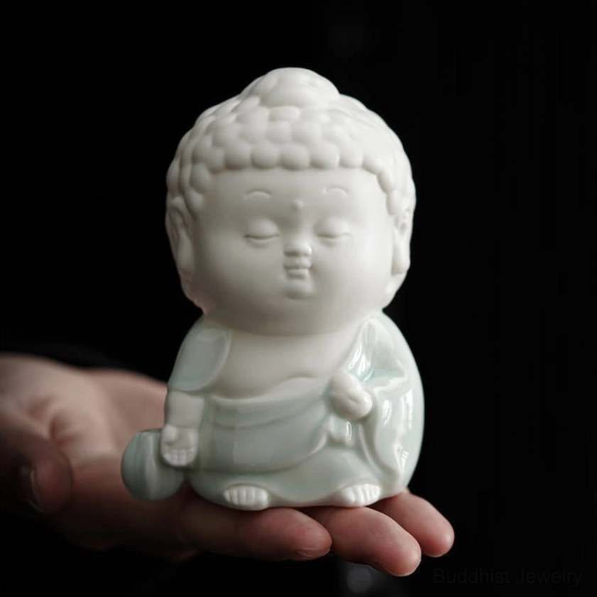 Handheld ceramic Buddha meditation burner showing prayer pose, white and celadon two-tone ceramic handcraft - eye-level view
