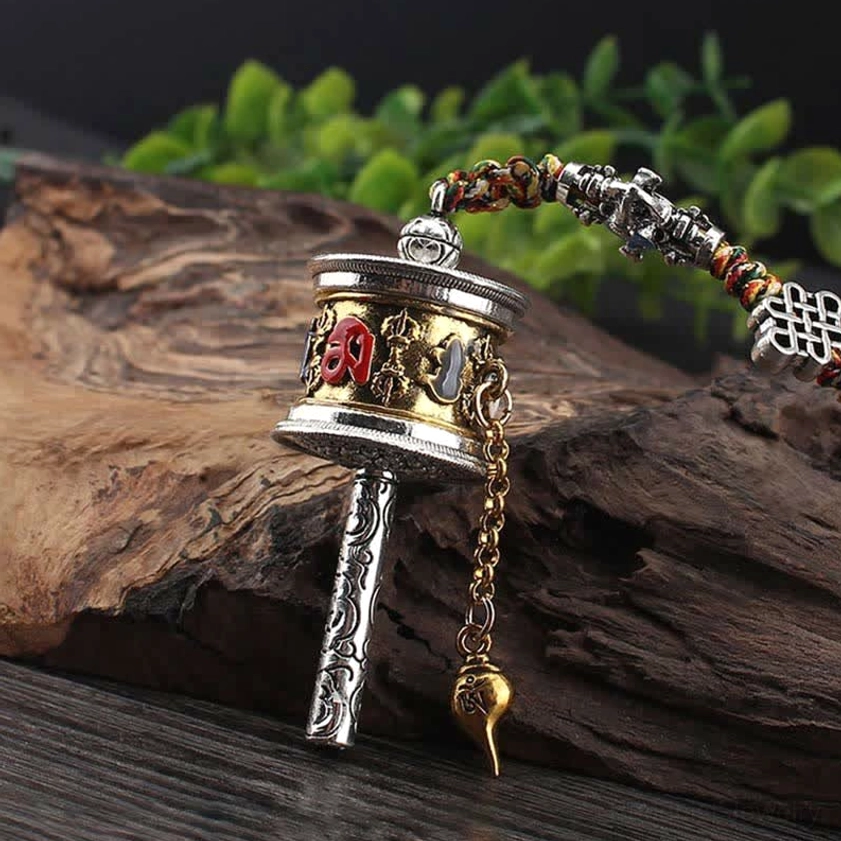 Buddhist prayer wheel car hanging decoration with bronze-silver tone, golden drop pendant, and embossed sutra on the drum
