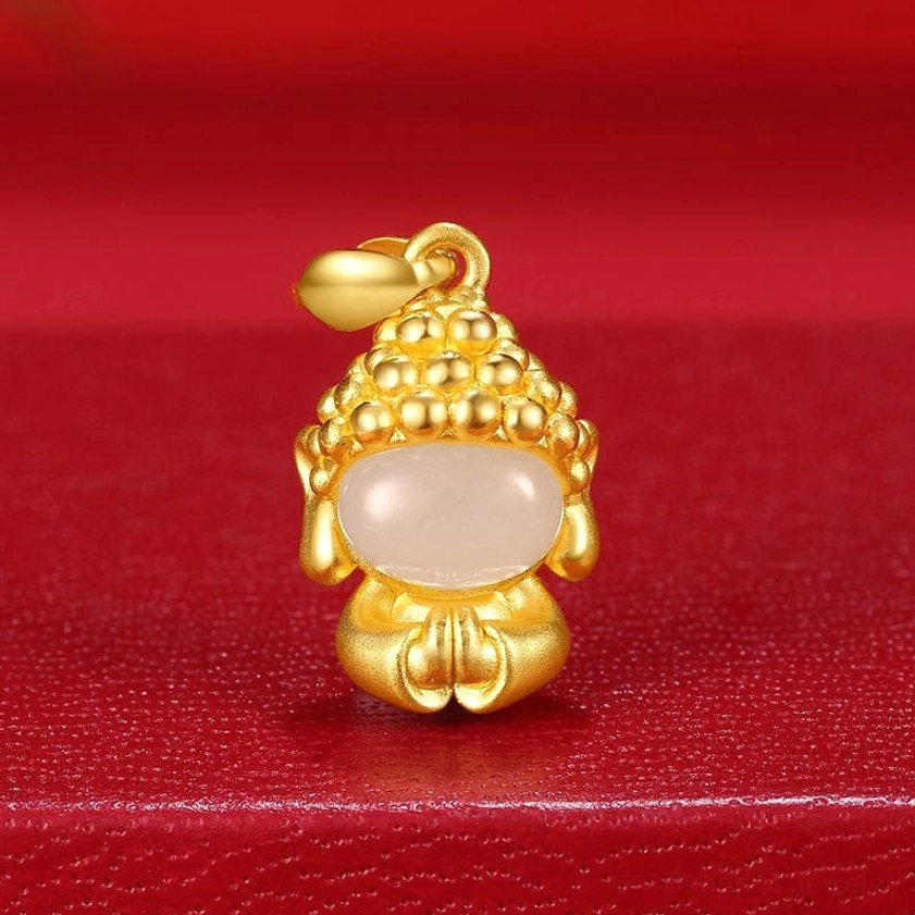 Praying Buddha pendant on red velvet - white jade inlay with ornate gold-tone metal frame