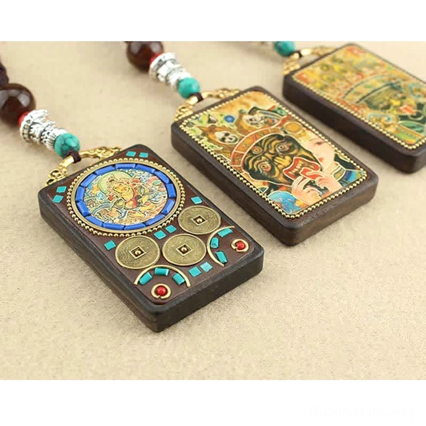Premium ebony wood Buddhist Thangka pendant necklace detail view, showcasing fine carving work and natural wood grain with deity artwork