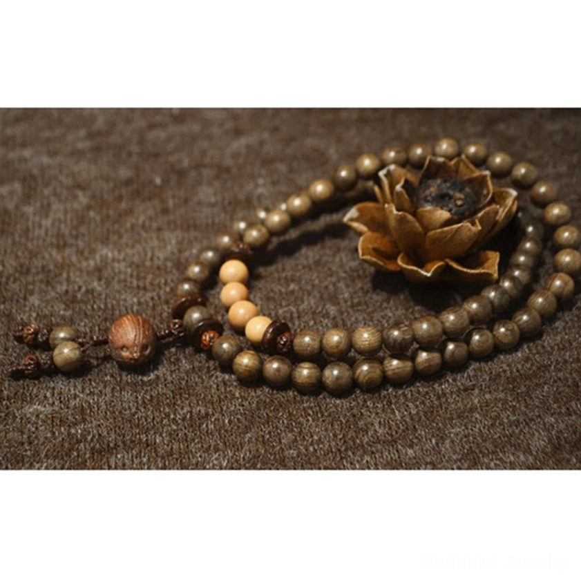 Premium sandalwood mala bracelet showing natural wood texture and bead craftsmanship, traditional Buddhist prayer beads for mindfulness