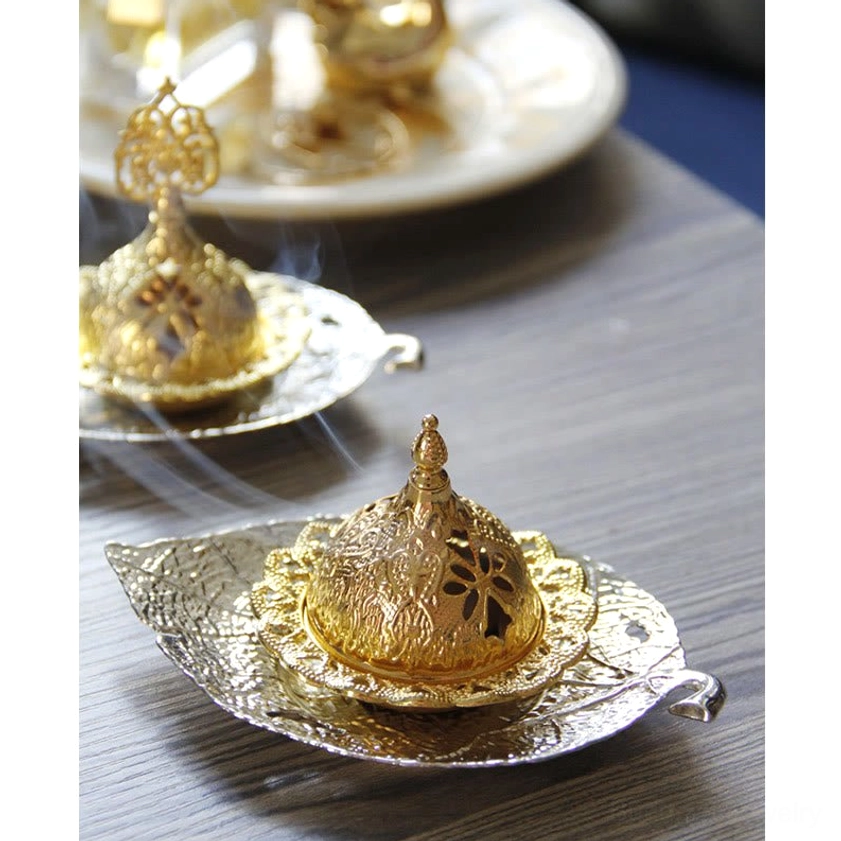Premium zinc alloy incense burner with glowing metallic finish and artistic carved design