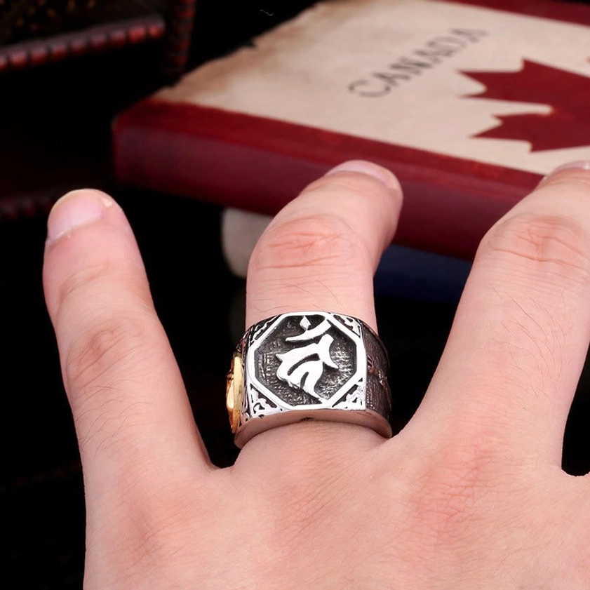 Titanium steel protection ring worn on index finger demonstrating daily wearability and spiritual purpose