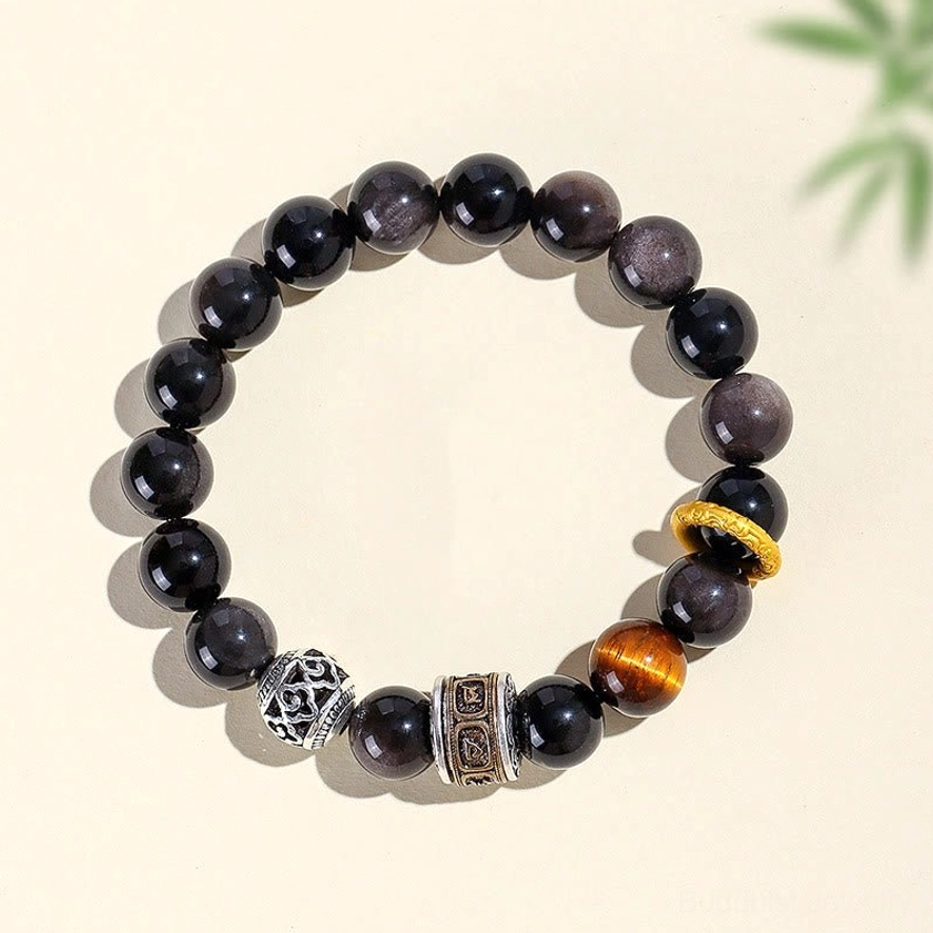 Silver Sheen Obsidian Tiger Eye bracelet displayed on beige background with bamboo shadow