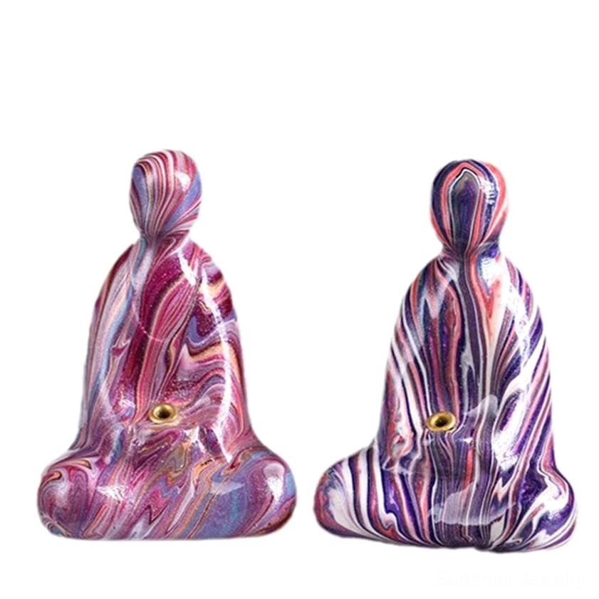 Matching purple-blue marbled Buddha incense holders in symmetrical meditation pose front view