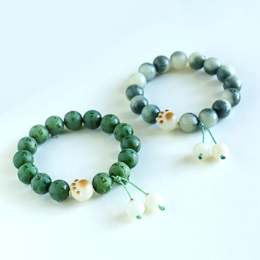 Purple Bodhi Seed Buddhist bracelet featuring deep violet carved beads with Om Mani Padme Hum inscriptions