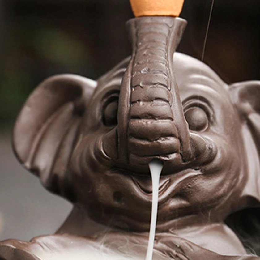 Detail view of purple clay elephant incense holder highlighting natural material texture and craftsmanship