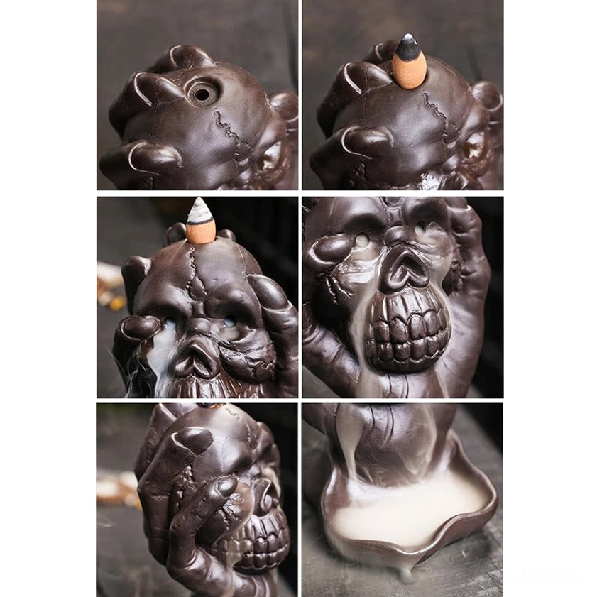 Handcrafted purple clay skull backflow incense burner with ghost hand - complete product lifestyle shot