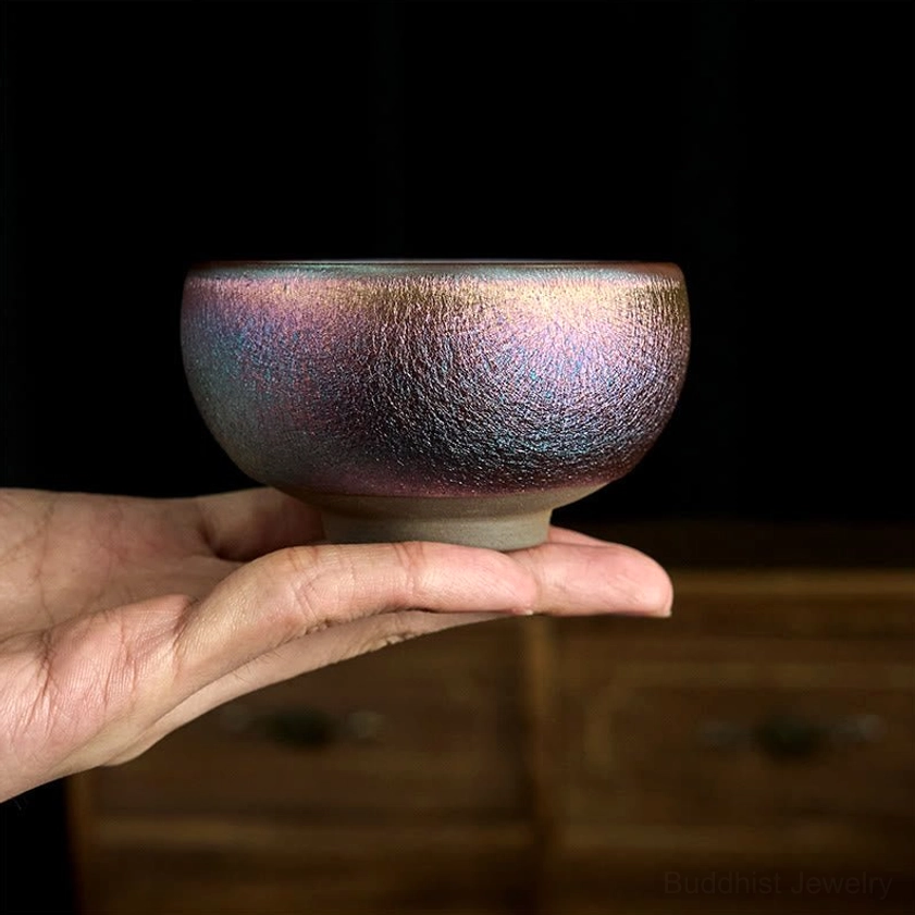 Purple gold koi fish Jianzhan tea cup with glaze detail and lotus leaf design showcase