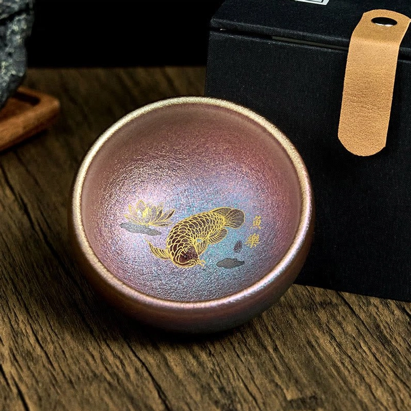 Purple gold koi fish Jianzhan ceramic teacup handmade with top-down view showing inner design